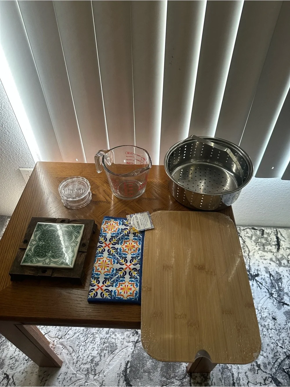 Black Wire Dish Drying Rack with Glass Measuring Cup and other Kitchen Items